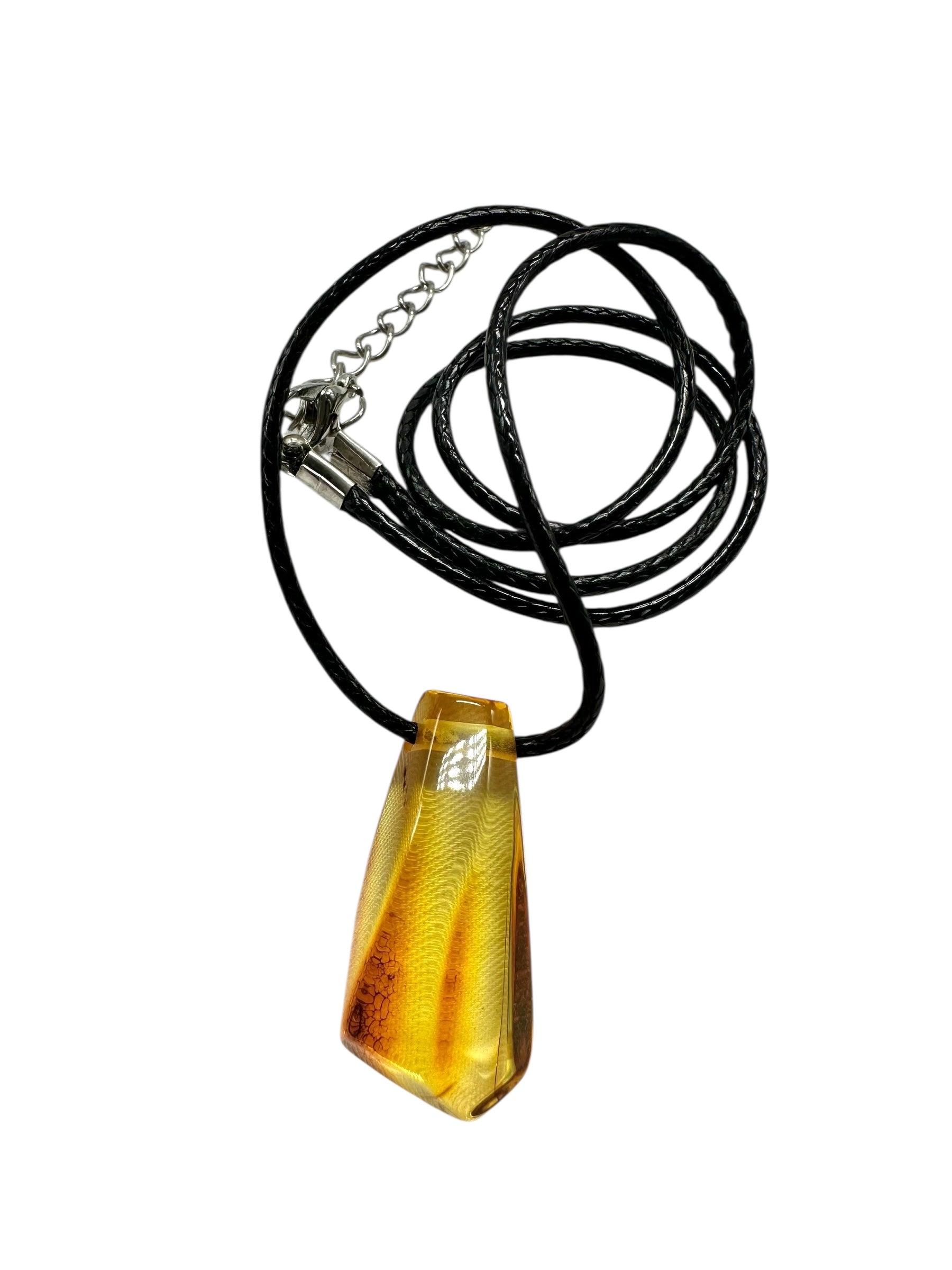 Amber pendant with leather cord