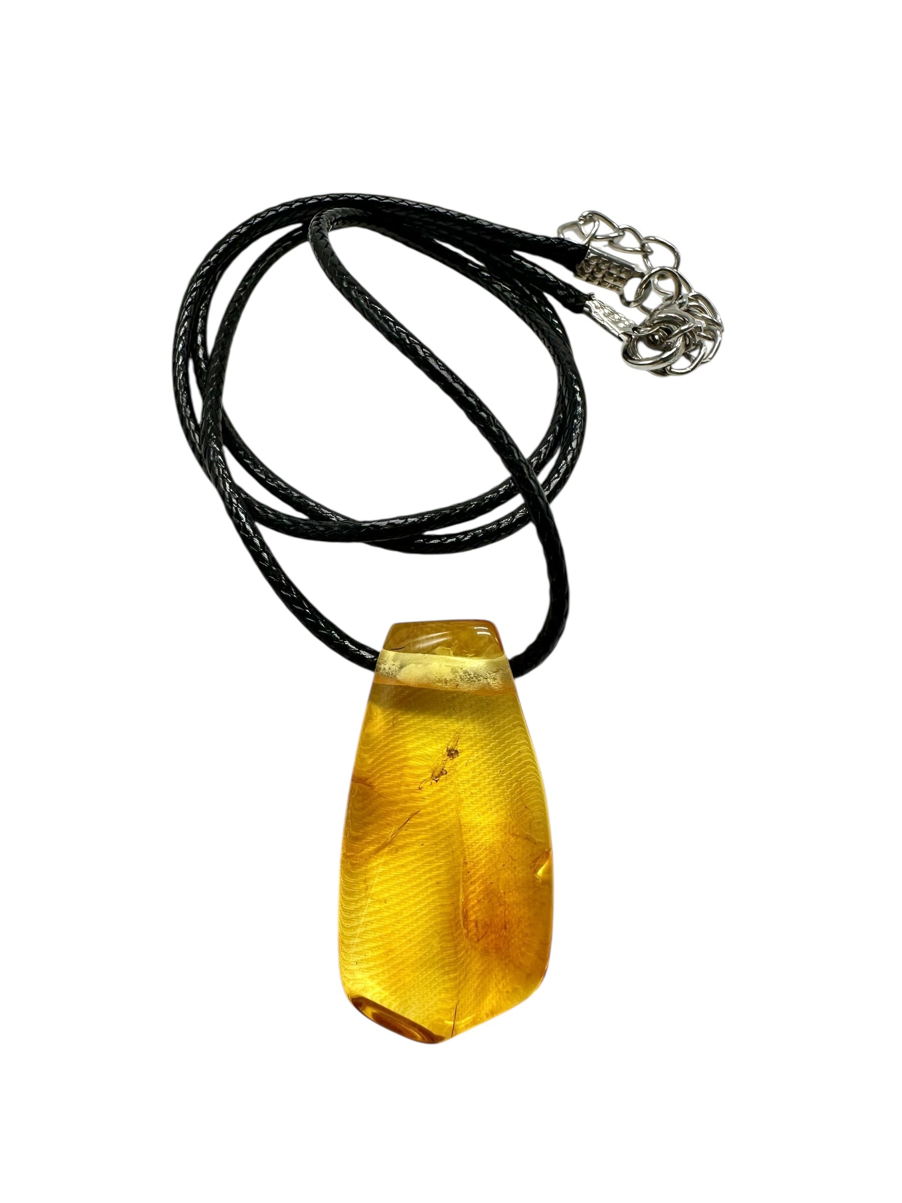 Amber pendant with leather cord