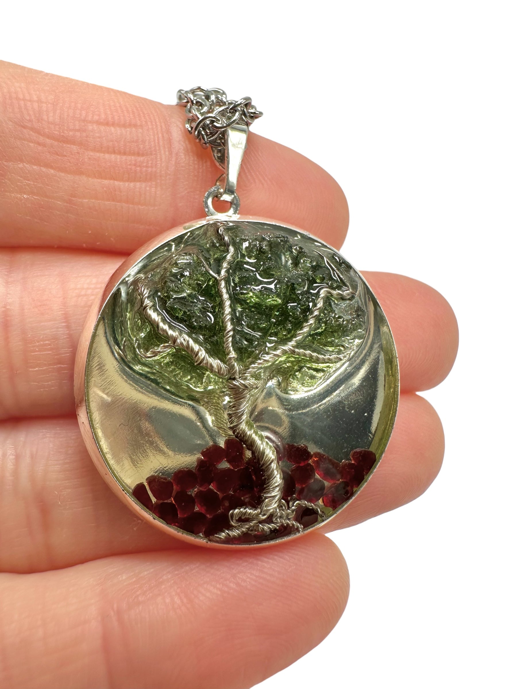 Pendant with moldavite and Czech garnet encased in resin
