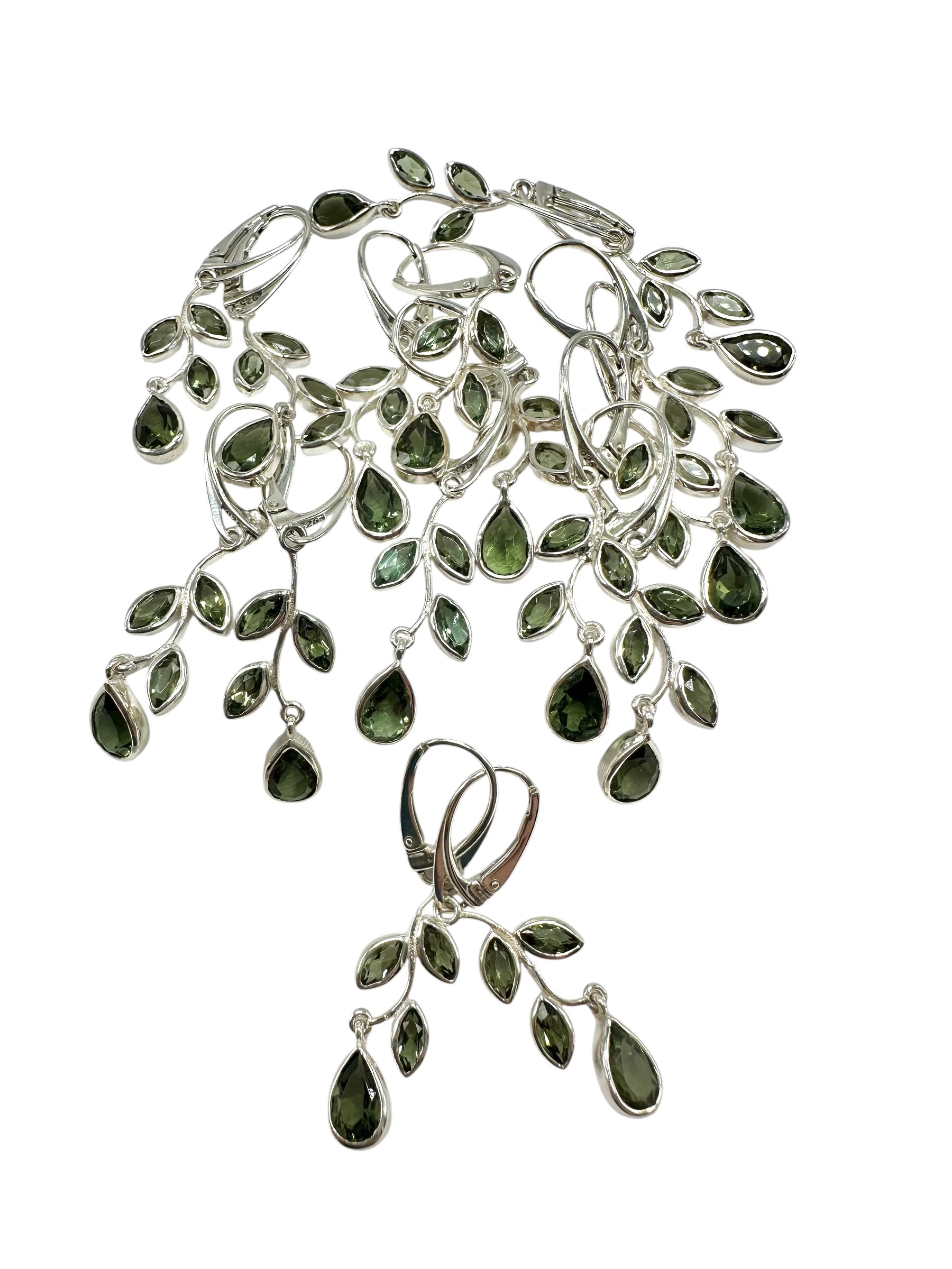 8 silver earrings with cut moldavites