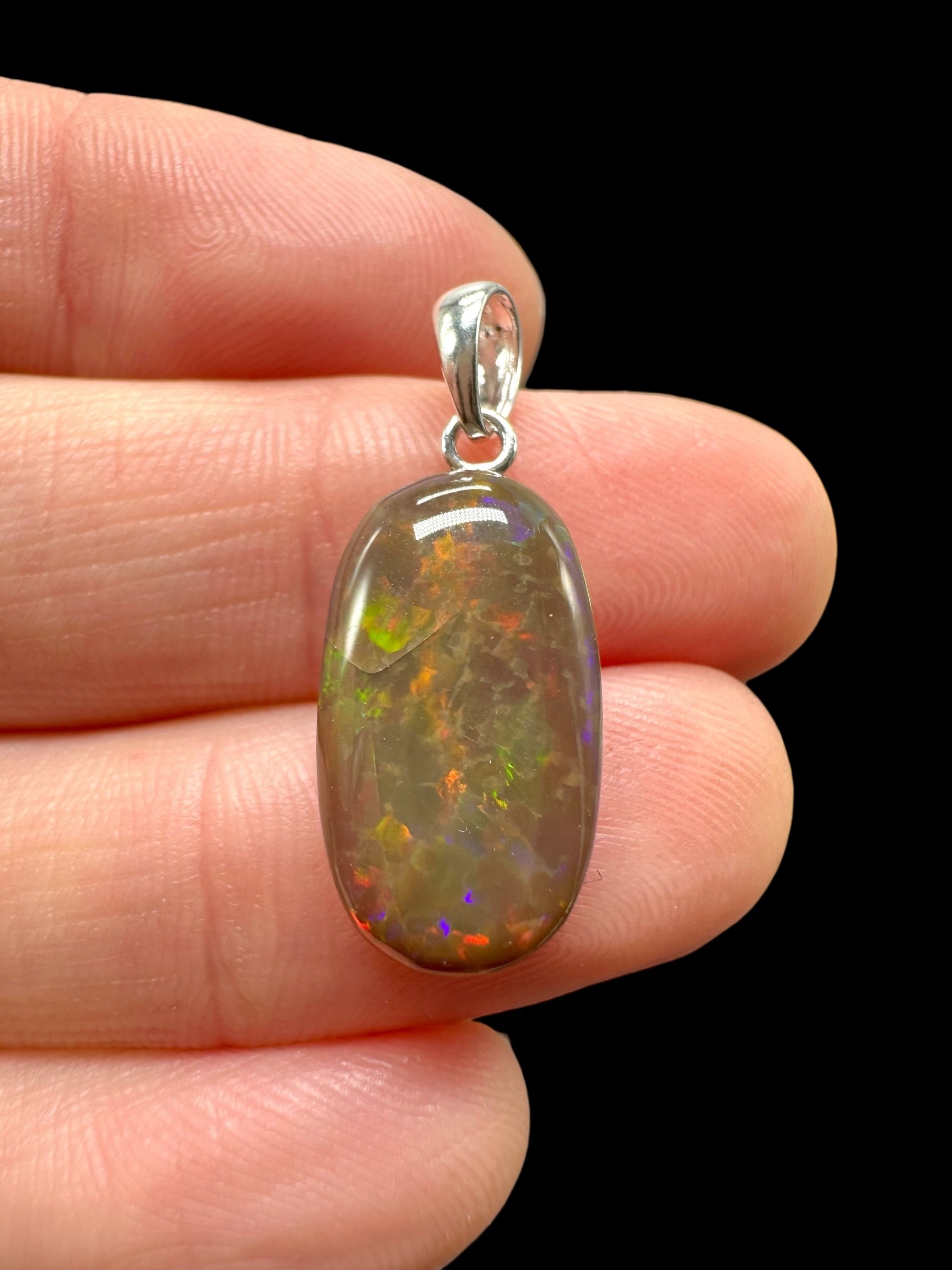 Silver faceted precious opal pendant