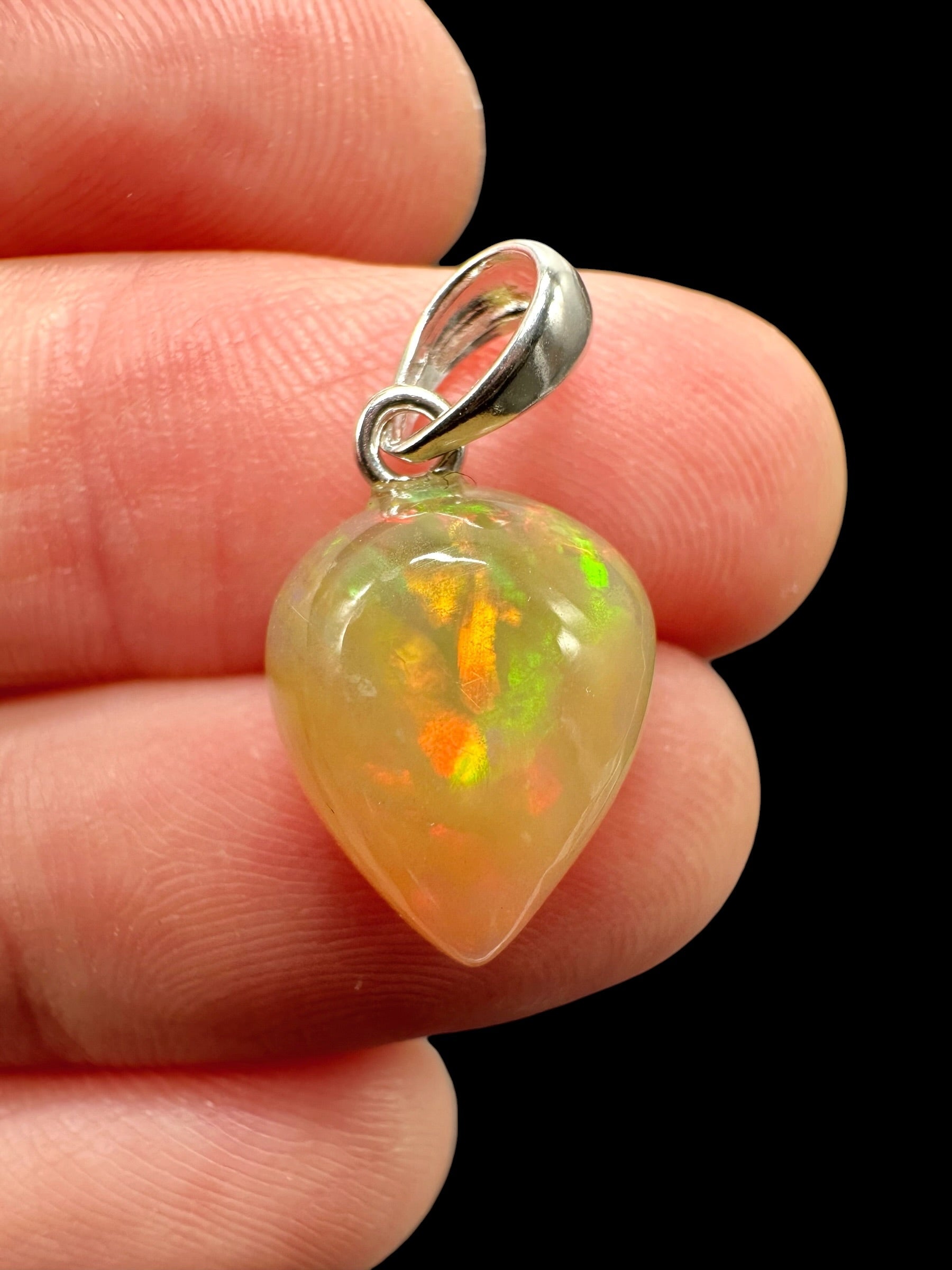 Silver faceted precious opal pendant