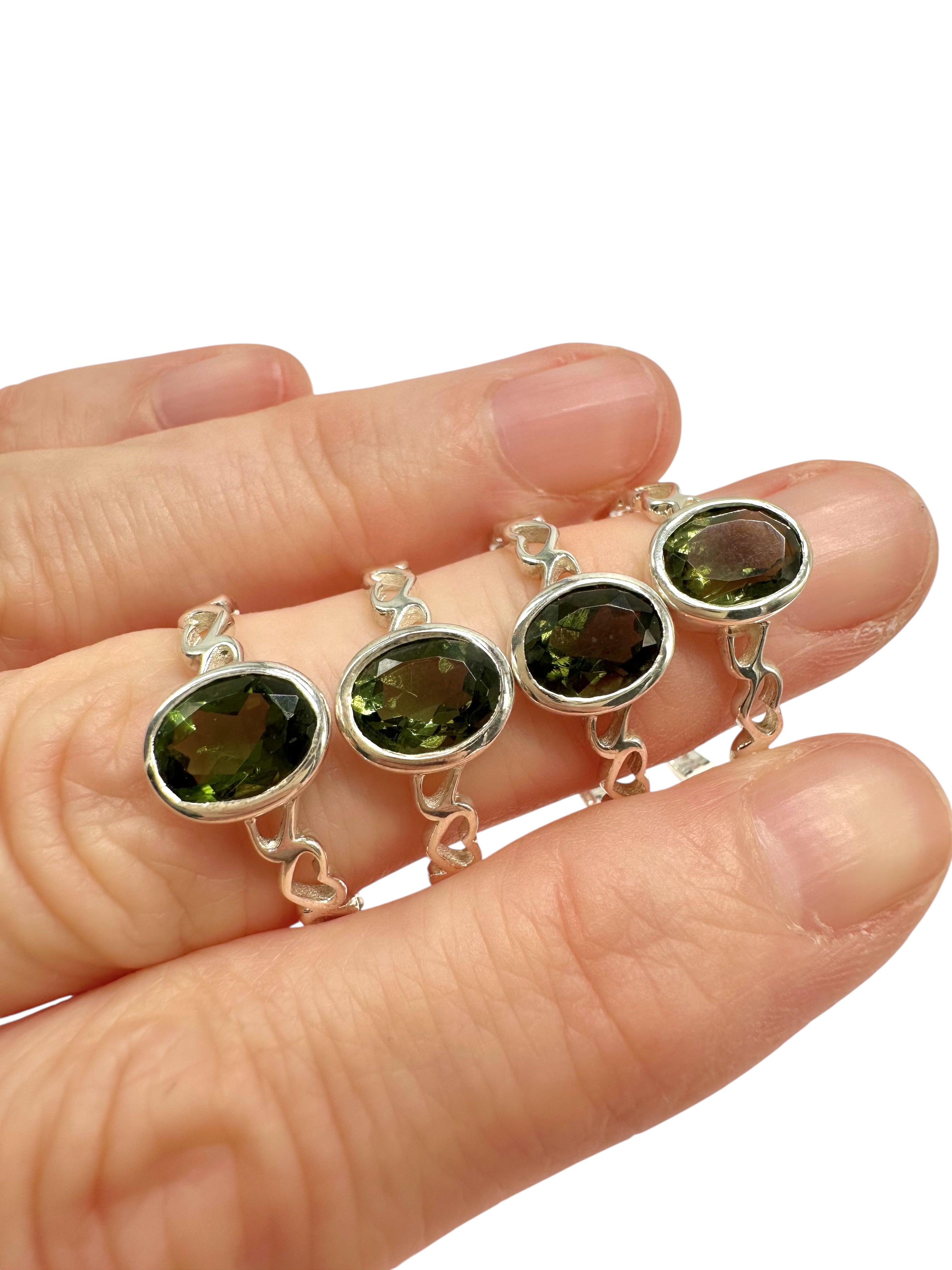 4 silver rings, size 58, with cut moldavites