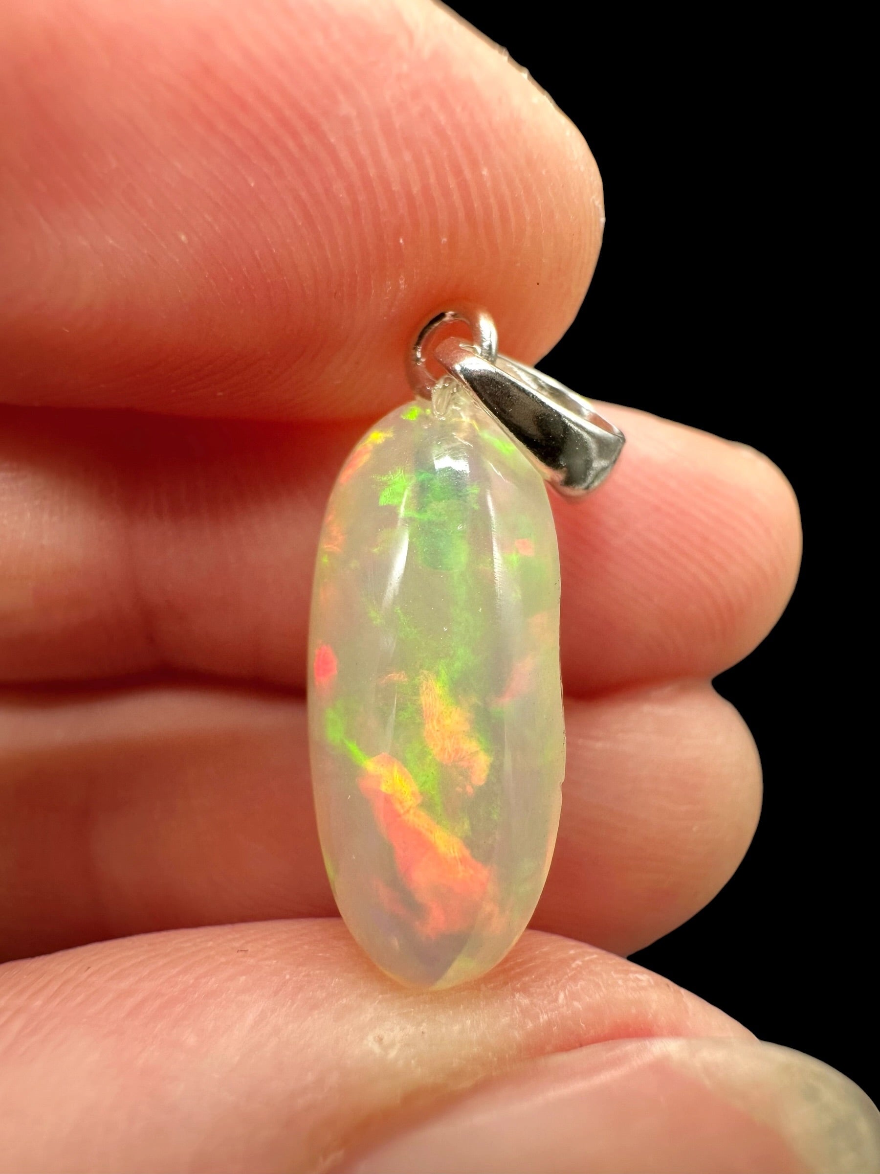 Silver faceted precious opal pendant