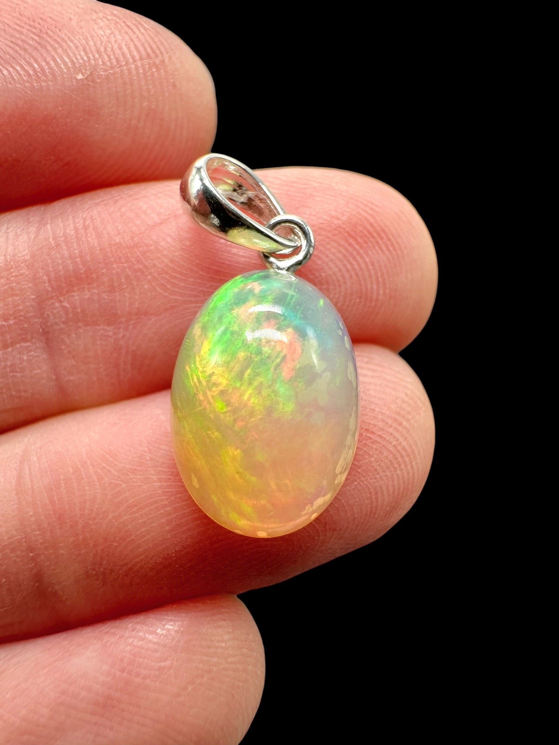 Silver faceted precious opal pendant