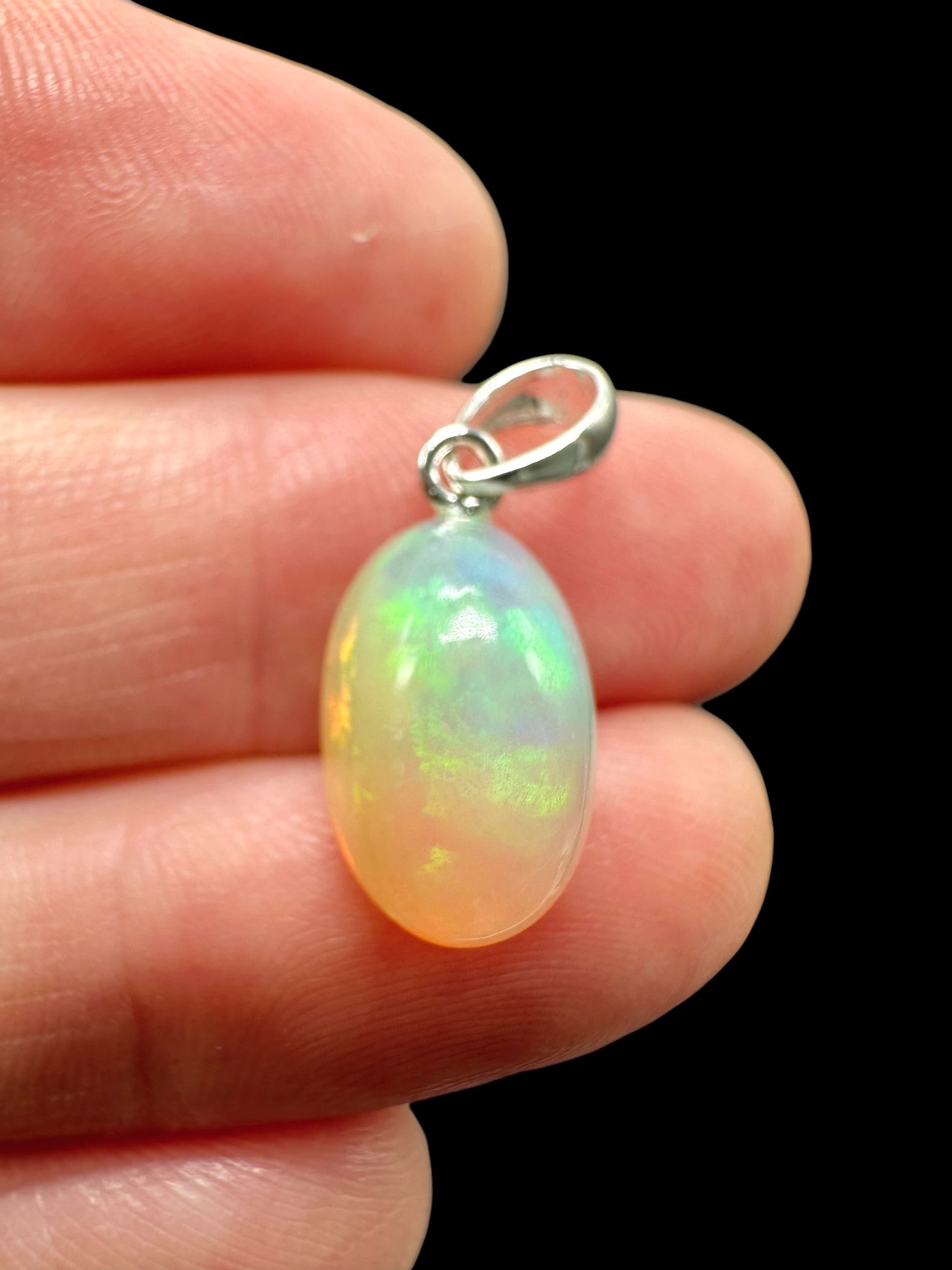 Silver faceted precious opal pendant