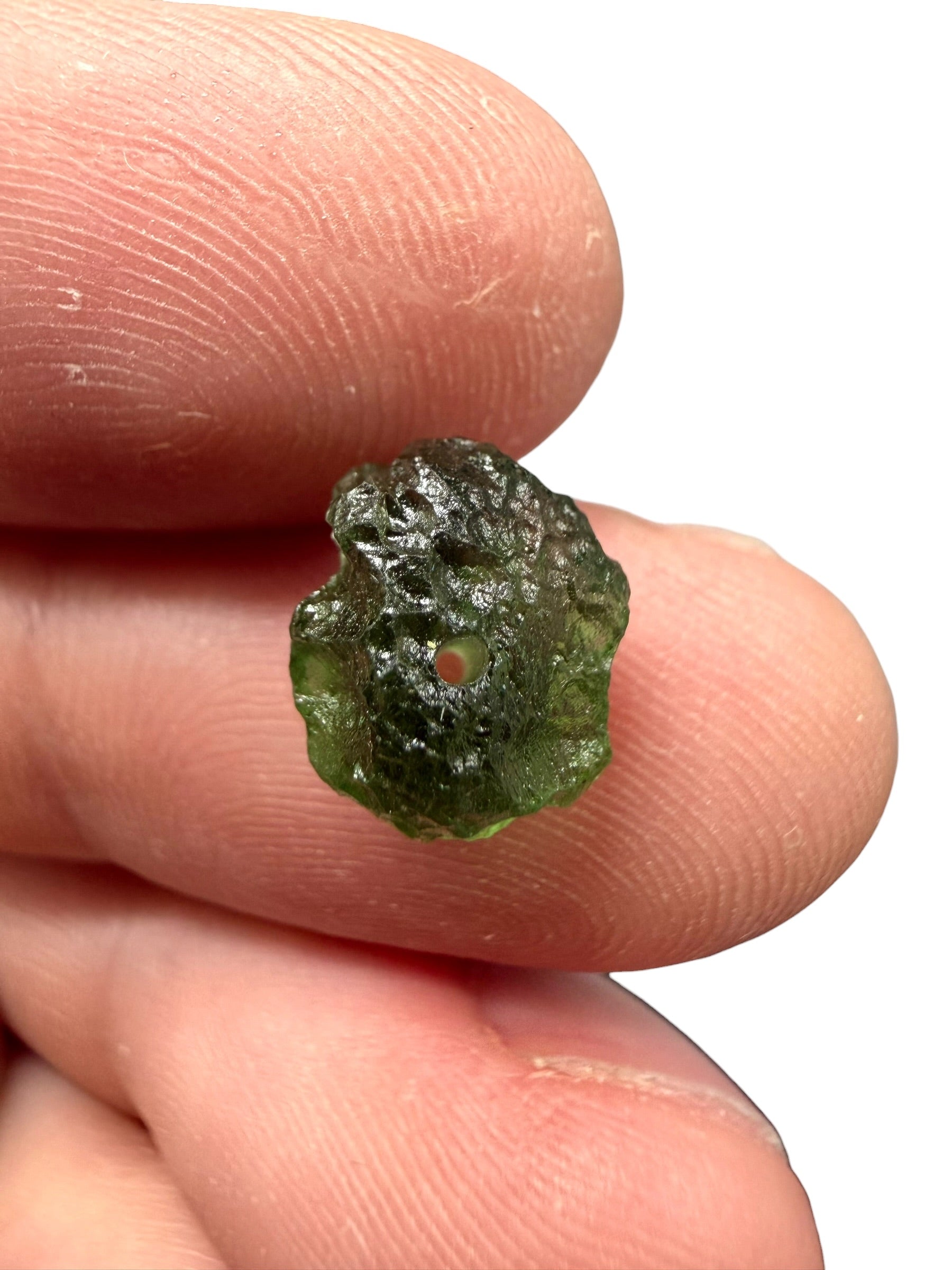 A bead made of raw moldavite 0,7g