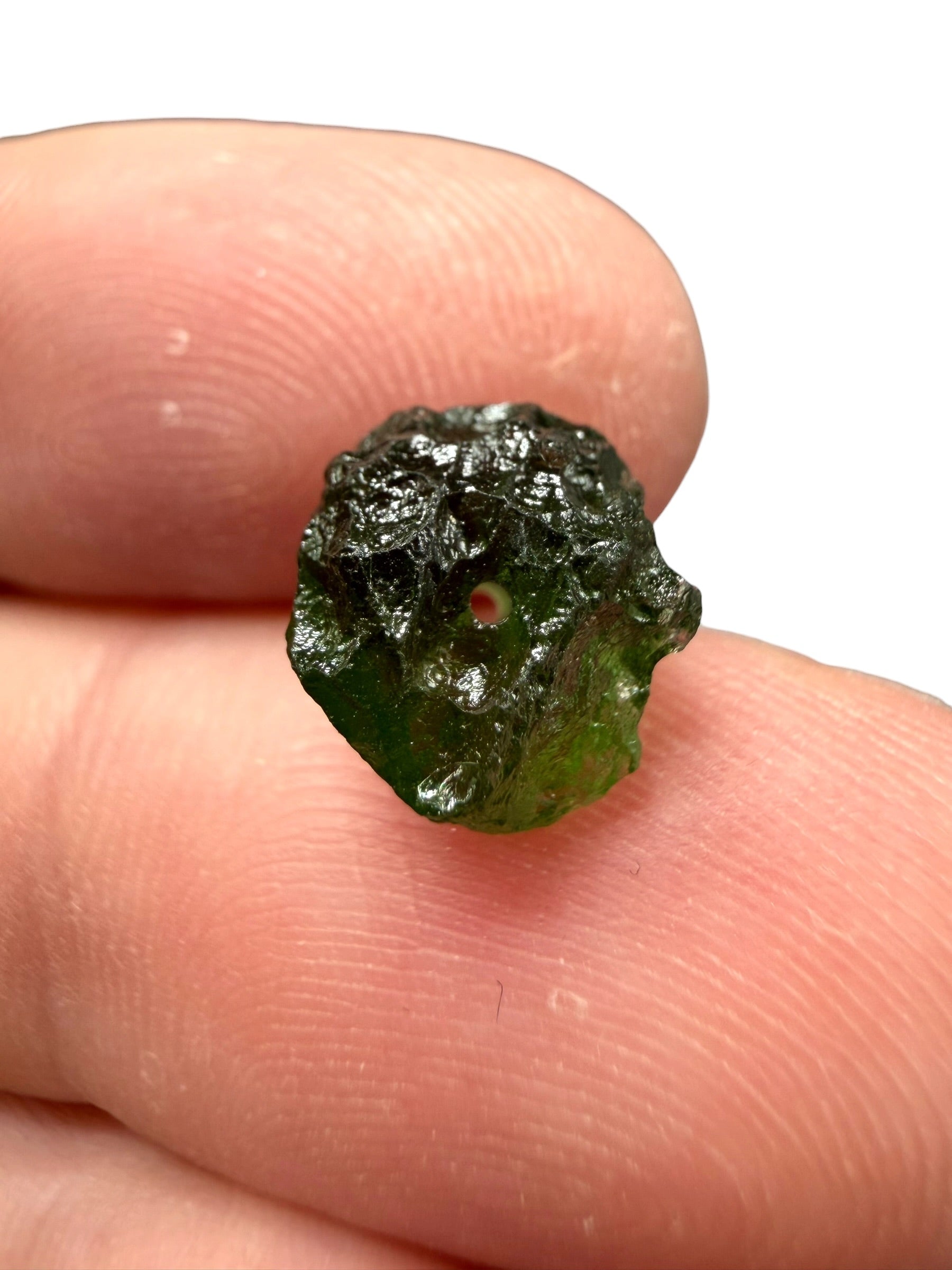 A bead made of raw moldavite 0,7g