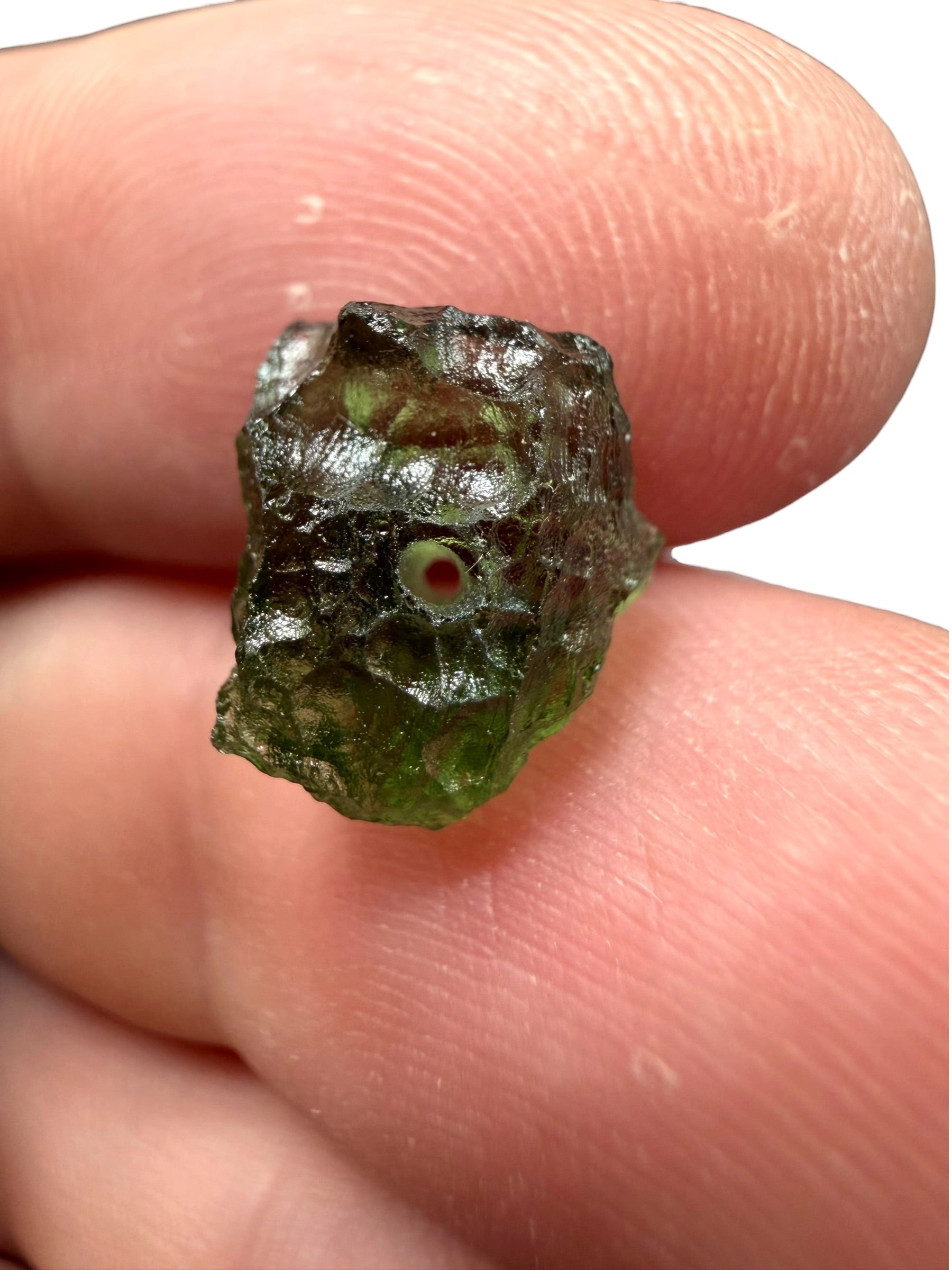 A bead made of raw moldavite 0,5g