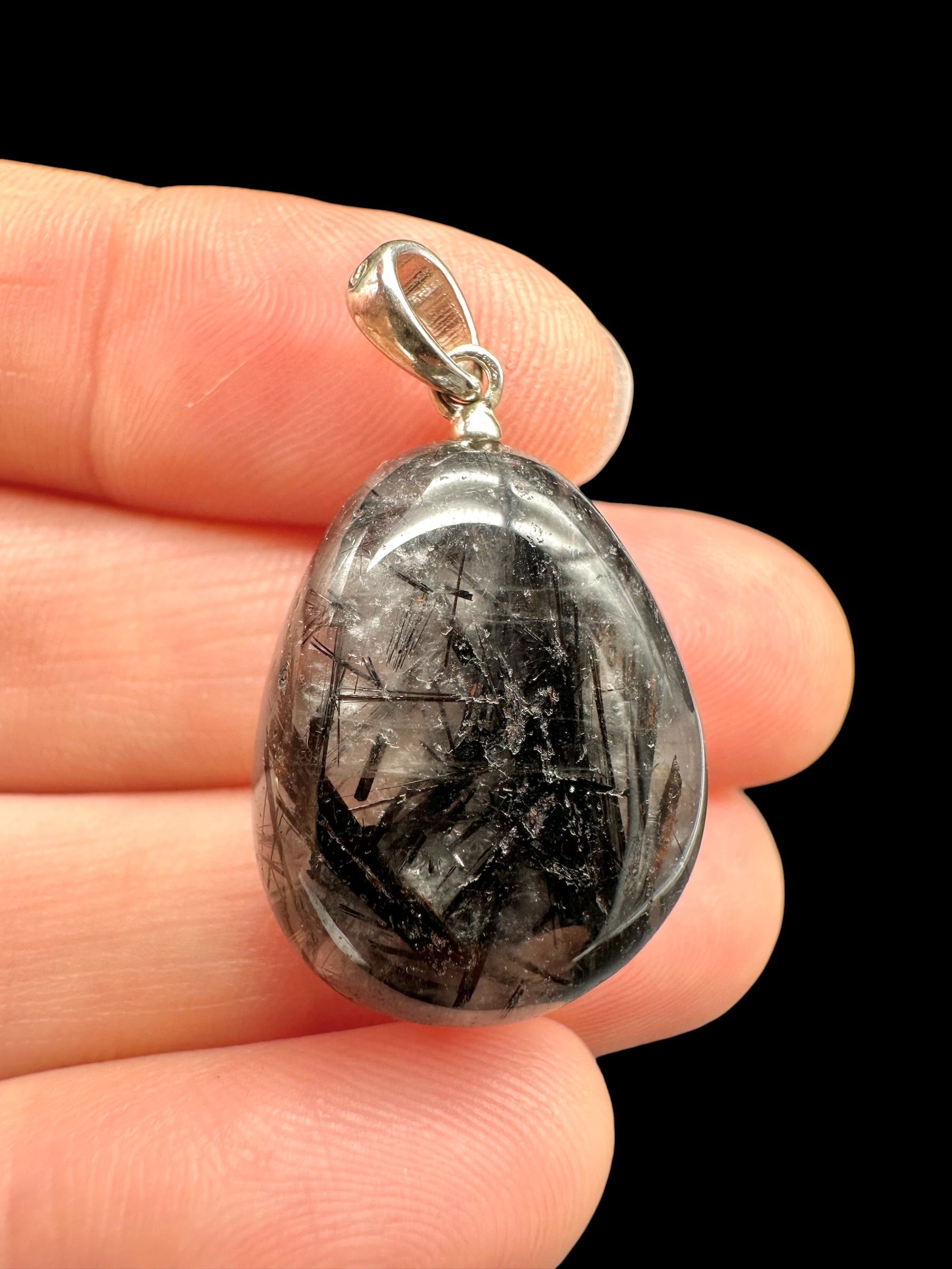 Silver pendant made of crystal with tourmaline
