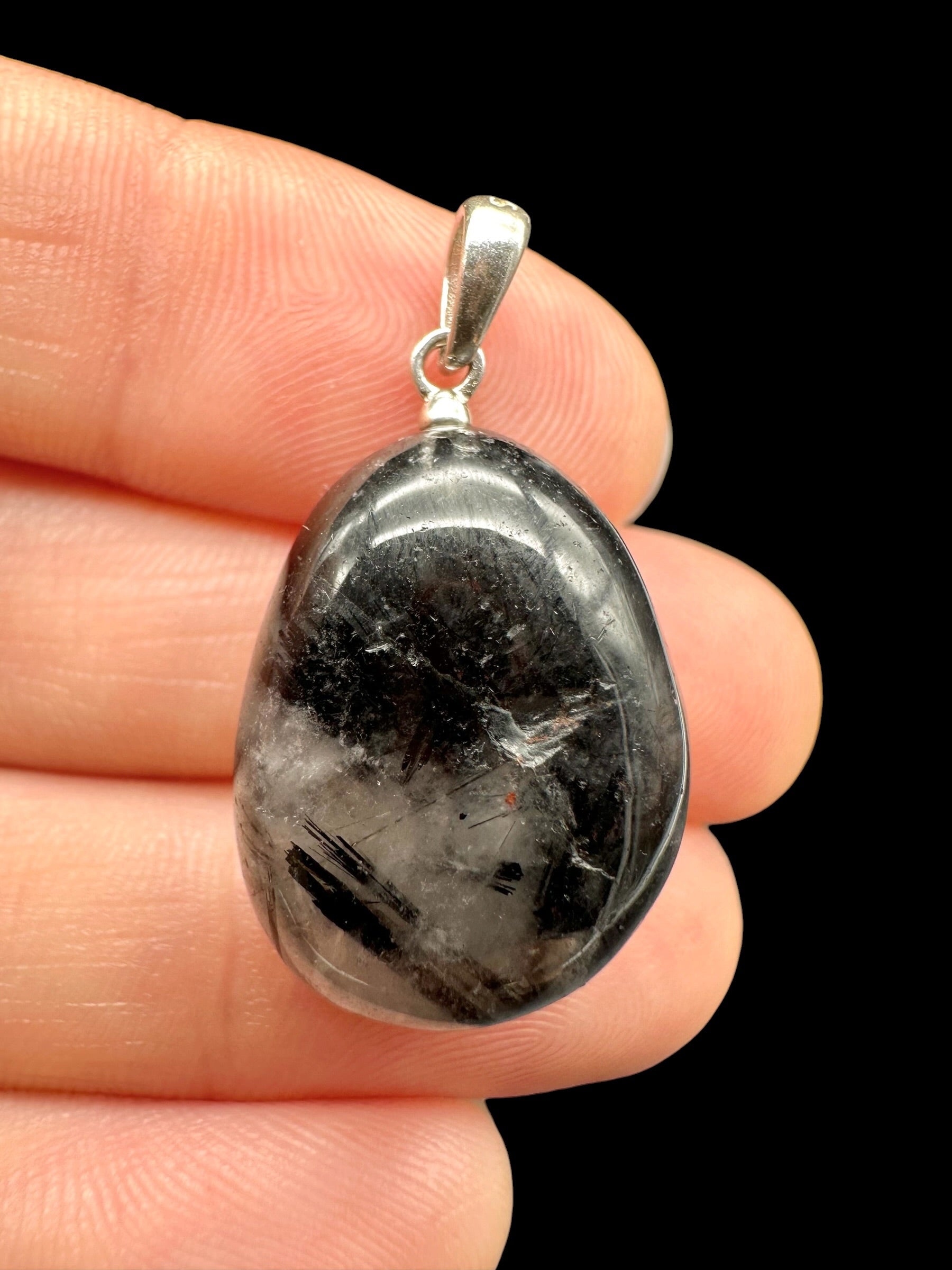 Silver pendant made of crystal with tourmaline