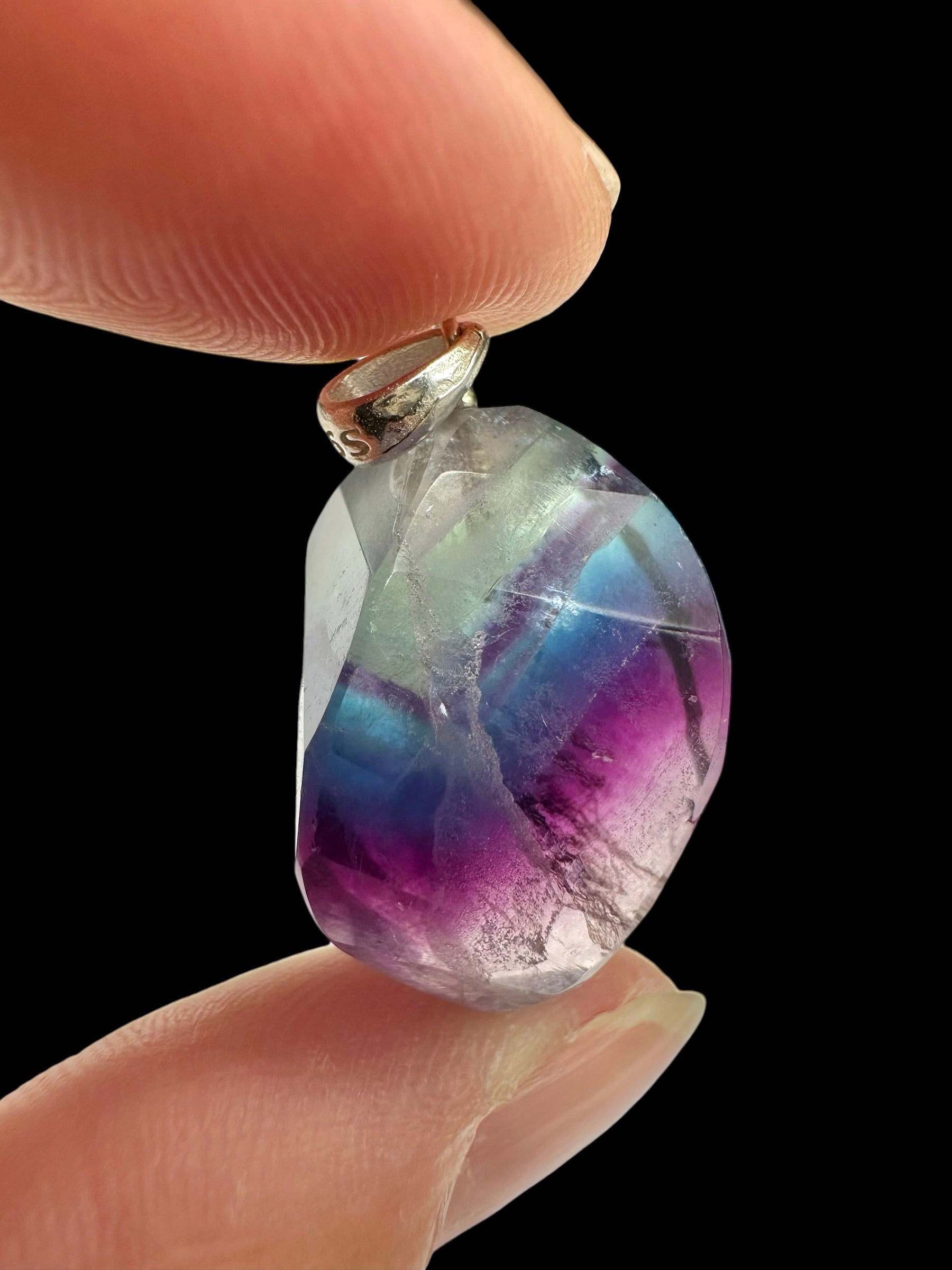 Silver pendant made of faceted fluorite