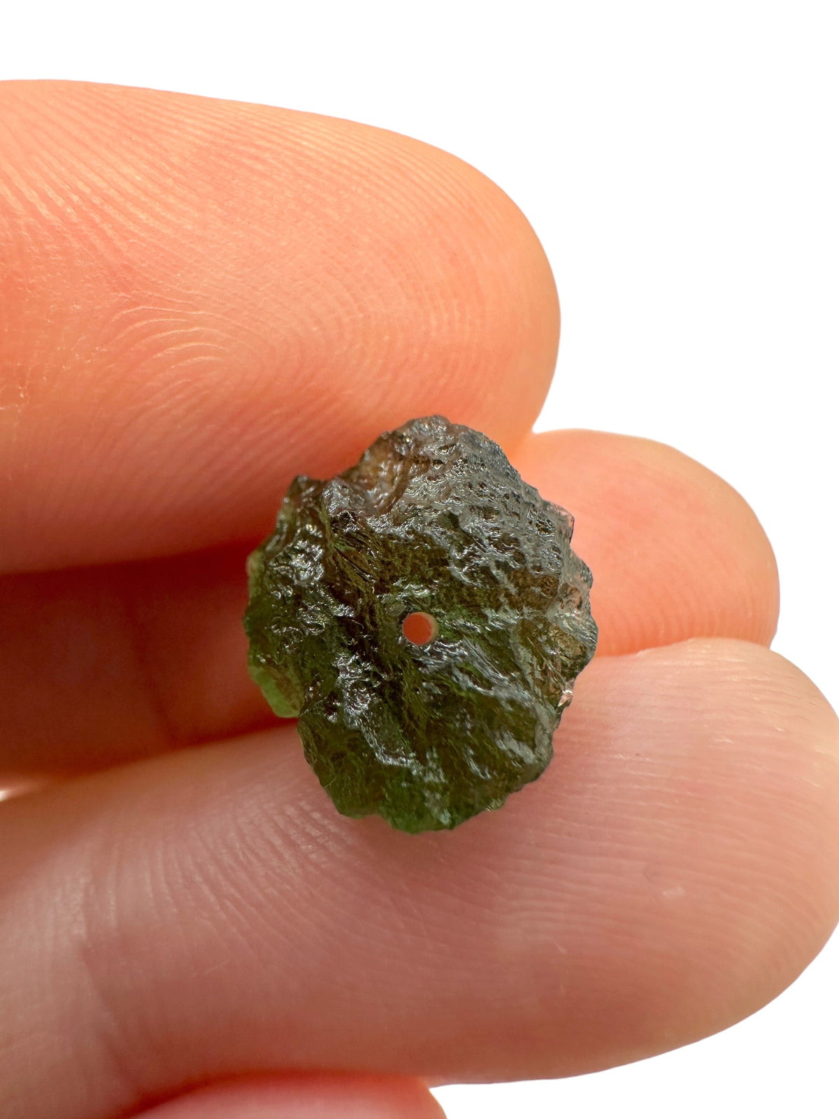 A bead made of raw moldavite 0,88g