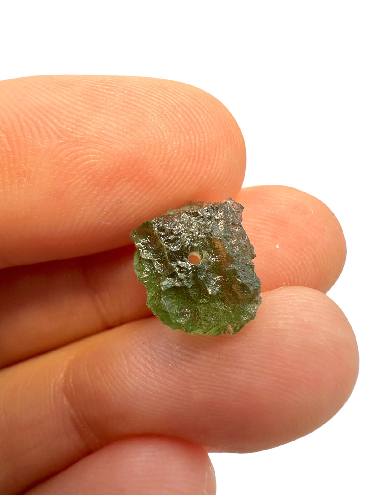 A bead made of raw moldavite 0,86g