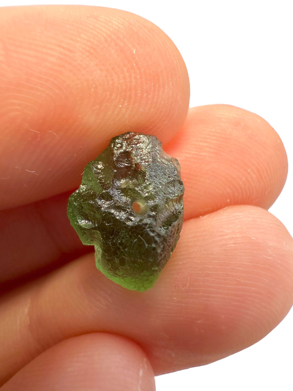 A bead made of raw moldavite 0,74g