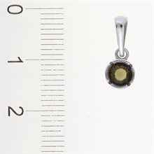 Silver pendant with moldavite