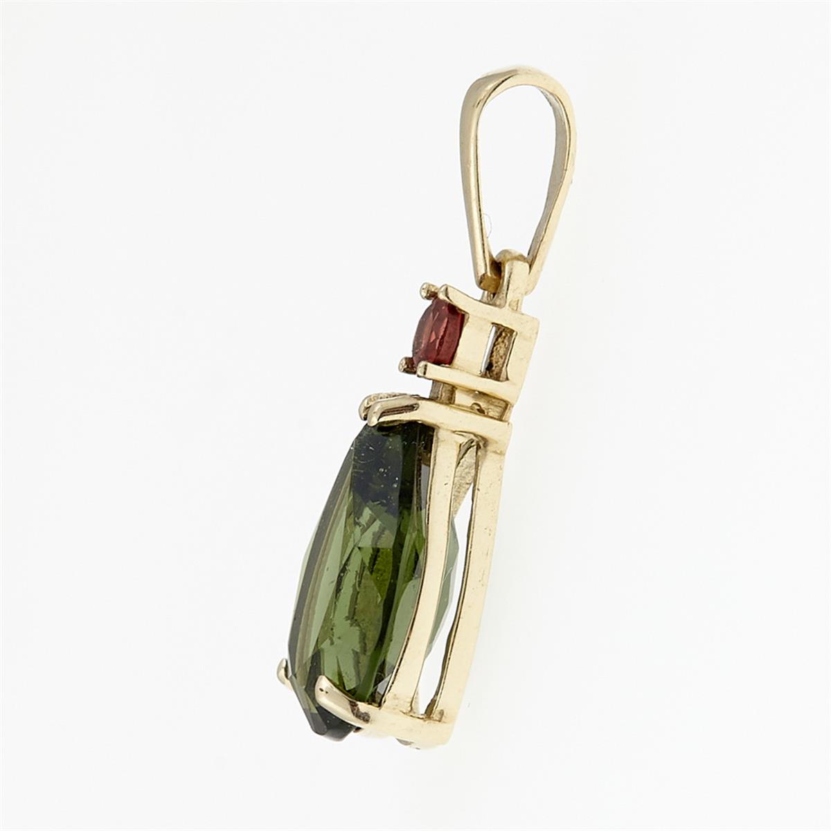 Golden pendant with moldavite and garnets 1334
