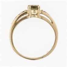 Anello in oro con moldavite e granati 3038