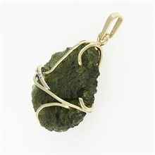 Golden pendant with a moldavite and zirconia 5664