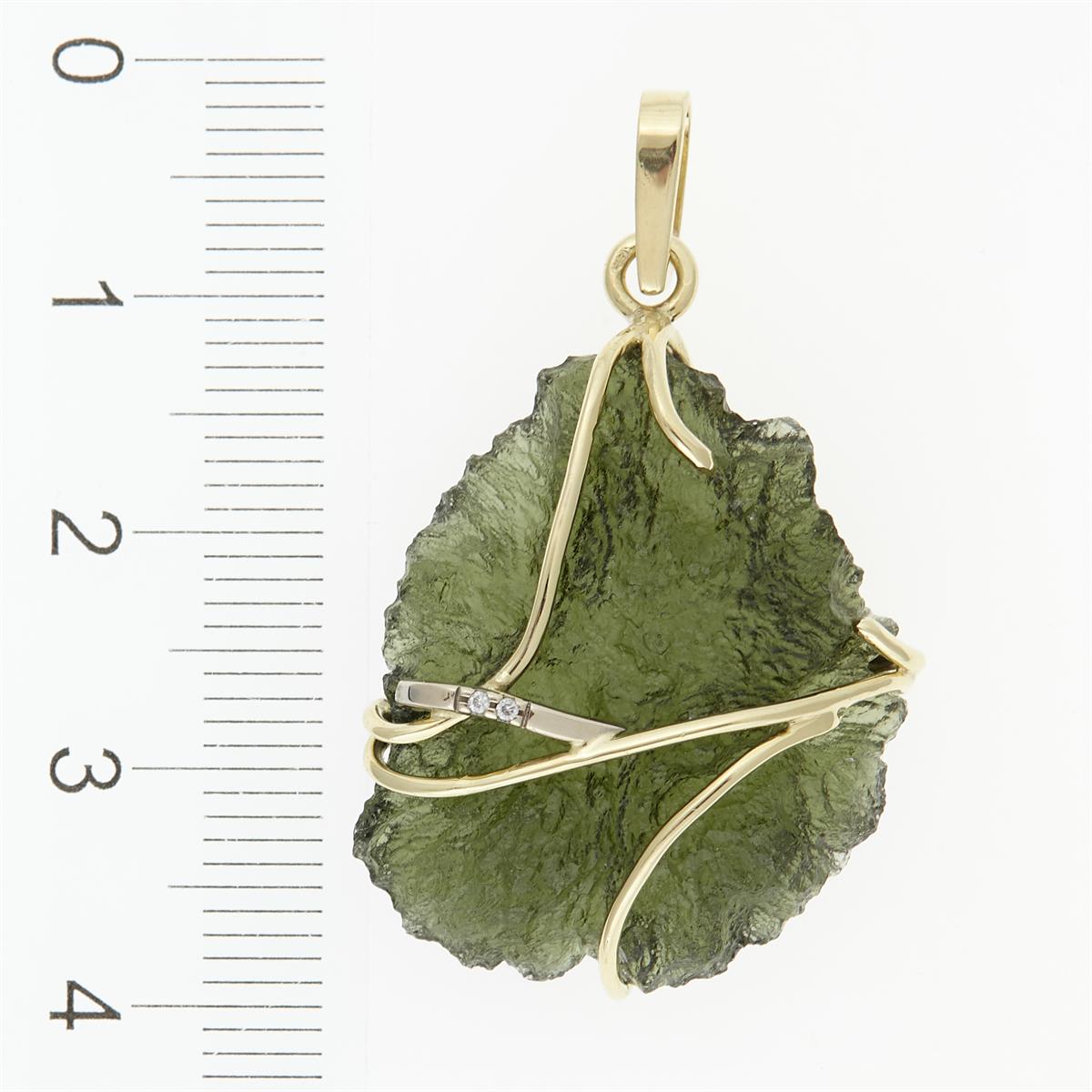 Golden pendant with a moldavite and zirconia 5664