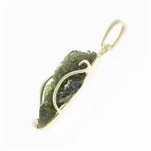 Golden pendant with a moldavite 26-006