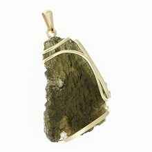 Golden pendant with a moldavite and zirconia 9489