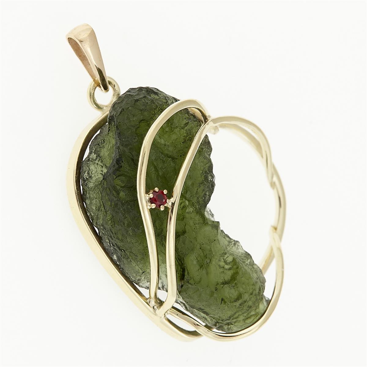 Golden pendant with a moldavite and garnet 9508