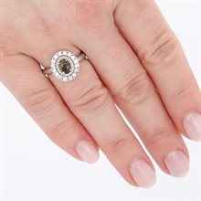 Anello in argento con moldavite e zirconi 157